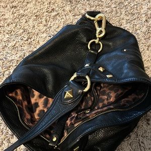 B Makowsky black leather handbag. Beautiful gold accents